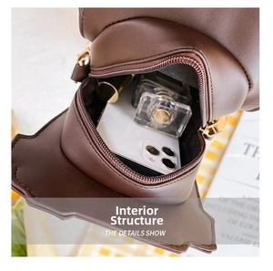 Detailed interior of coffee cup shaped crossbody bag showing phone and lipstick space