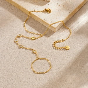 Elegant gold stainless steel finger bracelet with geometric zircons on natural stone base