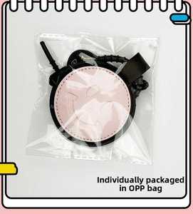 Pink and black leather heart pendant with smiley face pattern in OPP individual packaging