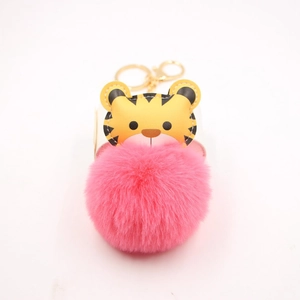 Cartoon tiger keychain with fluffy pink faux rabbit fur pompom and golden keyring clasp