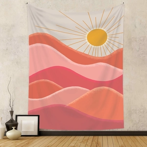Detail of bohemian tapestry featuring minimalist pink mountain landscape sunset decor