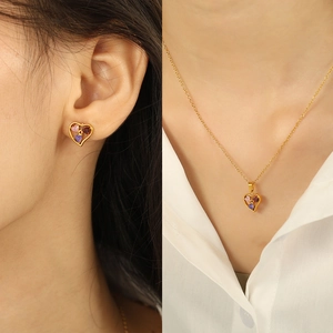 Golden heart jewelry set with colorful crystals including necklace and earrings