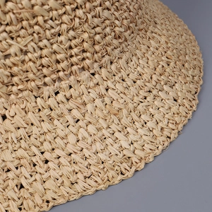 Handmade flat top raffia straw bucket hat for women in natural beige for summer sun shade