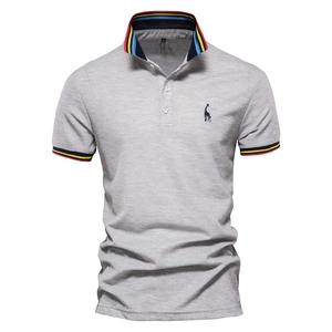 Close-up of gray cotton Polo shirt featuring deer embroidery and tricolor ribbed collar