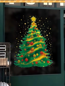 Close-up of double-sided Christmas tree window sticker with gold ornaments on glass