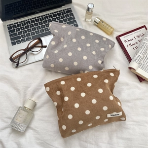 Schminktaschen aus Cord mit Punkten in Grau und Braun für Aufbewahrung und Reise