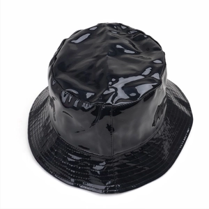 Detailed top view of the black glossy faux leather bucket hat with a reflective finish