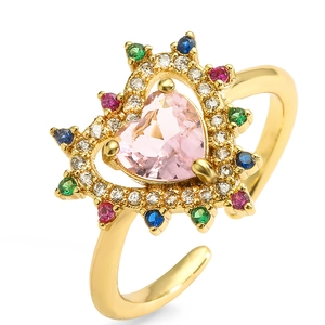 Detail of 18K gold plated ring with heart pink crystal and colorful gemstones