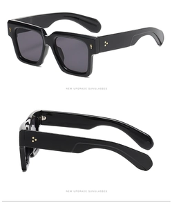 Dual view of black square sunglasses with golden star rivets and dark grey lenses