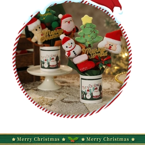 Detailed plush Christmas bouquet featuring Santa, snowman, and tree in a white bucket