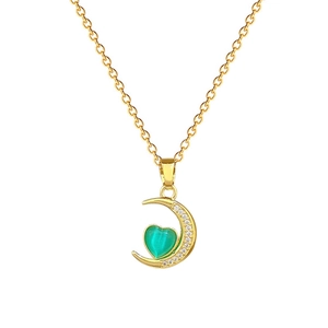 Elegant gold titanium moon necklace with green heart gemstone and sparkling crystals