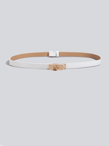 Detail of white Saffiano leather skinny belt with golden lock buckle and texture