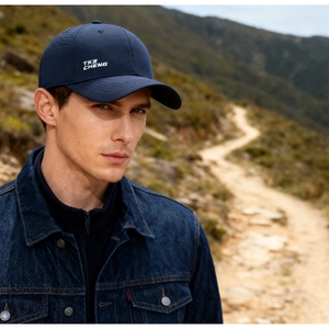 Detail of dark blue quick-dry baseball cap mesh side with TKZ CHENG logo text