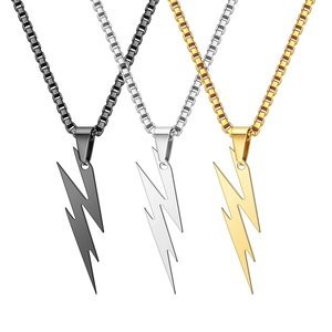 Detailed shot of three lightning pendants in black, silver, and gold on box chains