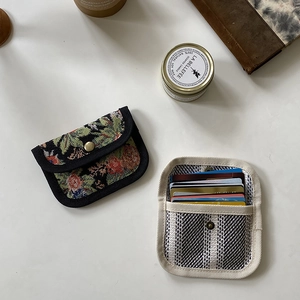 Flat lay of canvas card holders in floral and striped patterns with large capacity