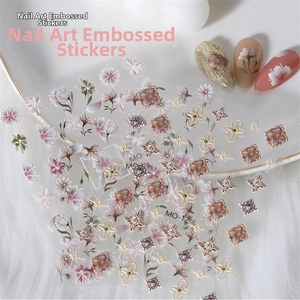 Detail of 5D embossed nail stickers with white tulip and pink floral 3D texture designs