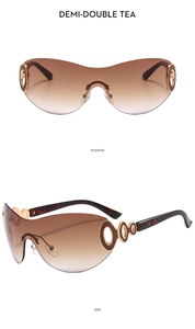 Detail of rimless Y2K sunglasses with gradient tea lenses and gold hollow ring decor
