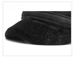 Detailed view of the sturdy black brim and plush texture of the winter trapper hat