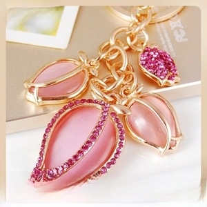 Detailed close-up of pink tulip keychain with sparkling rhinestones and gold alloy metal