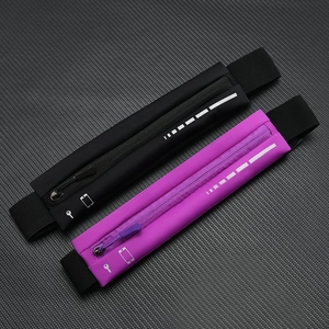 Detail of slim waterproof running belts in black and purple with reflective safety strips