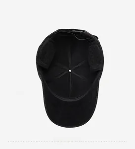 Detail view of the warm fleece lining and foldable ear flaps on this winter baseball cap