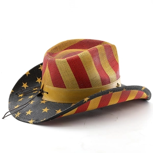 Close-up of a straw cowboy hat with US flag stripes and star patterns on the wide brim