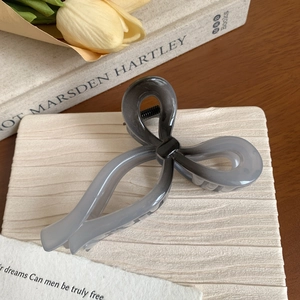 Elegant bow hair claw clip in grey and black gradient resin for women's hairstyles