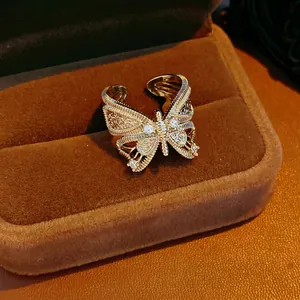 Vintage gold bowknot butterfly open ring with zircon crystals in a luxury jewelry box