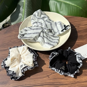 3-piece musical scrunchies set with piano notes and staff prints on black and white silk