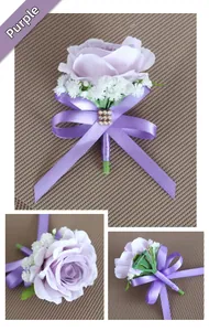 Detail view of purple silk rose corsage with lace ribbon and pin back for weddings