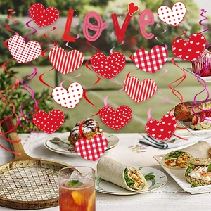 Red and white heart-shaped Valentine's ornaments with hanging LOVE letters for party decor