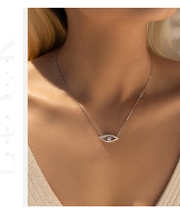 Close-up of S925 silver necklace with blue eye pendant and sparkling crystals