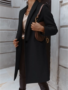 Detail of a black mid-length wool coat featuring a lapel collar and single-breasted buttons