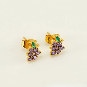 Detailed macro view of 18K gold-plated grape earrings with purple and green crystals