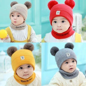 Baby winter knit hat and scarf set with dual pom poms shown in multiple colors