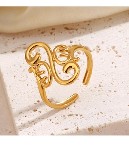 Detailed top view of a gold-plated geometric hollow ring on elegant stone texture background