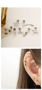 Detailed view of titanium labret studs and ear studs with sparkling zirconia settings