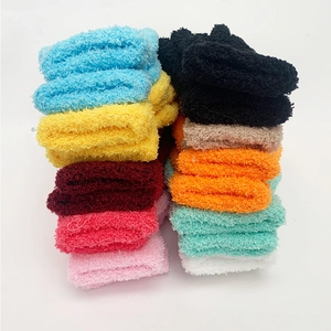 Vertical stack of multi-color thick coral fleece socks in 10 vibrant candy colors
