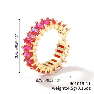 Detail of a gold adjustable ring with red rectangular gemstones and dimension annotations