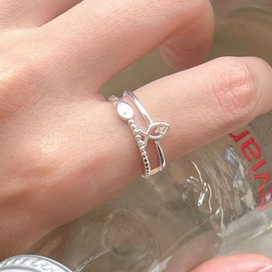 Minimalist S925 sterling silver fish ring set with zircon accents for a chic layered look