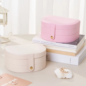 Three-layer D-shaped jewelry storage box in pink and beige PU leather for rings and earrings