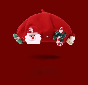 Detail of red wool beret featuring 3D Santa Claus and Christmas tree embellishments