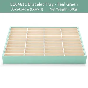 Top view of a turquoise 40-slot jewelry tray for organizing bracelets with dimensions