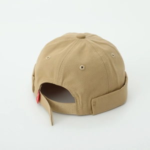 Detail of khaki miki hat with adjustable velcro strap and red label branding