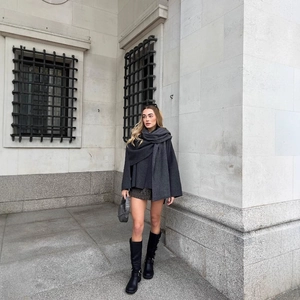 British style oversized dark grey wool coat with matching knit scarf and plaid skirt