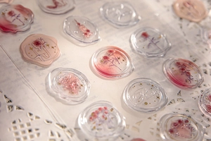 Close-up of 3D rose resin stickers with wax seal texture and gold foil detailing