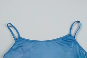 Detail of blue silk-like camisole neckline and thin straps with clean stitching
