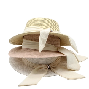 Detailed weave of three sun hats with chiffon ribbons and diamond embellishments