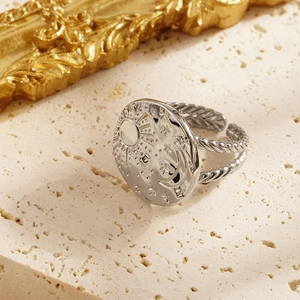 Adjustable celestial silver ring with sun moon and stars relief on textured band