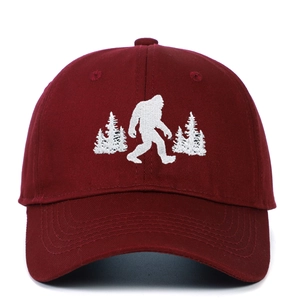 Vintage burgundy washed cotton baseball cap with white Bigfoot and pine tree embroidery